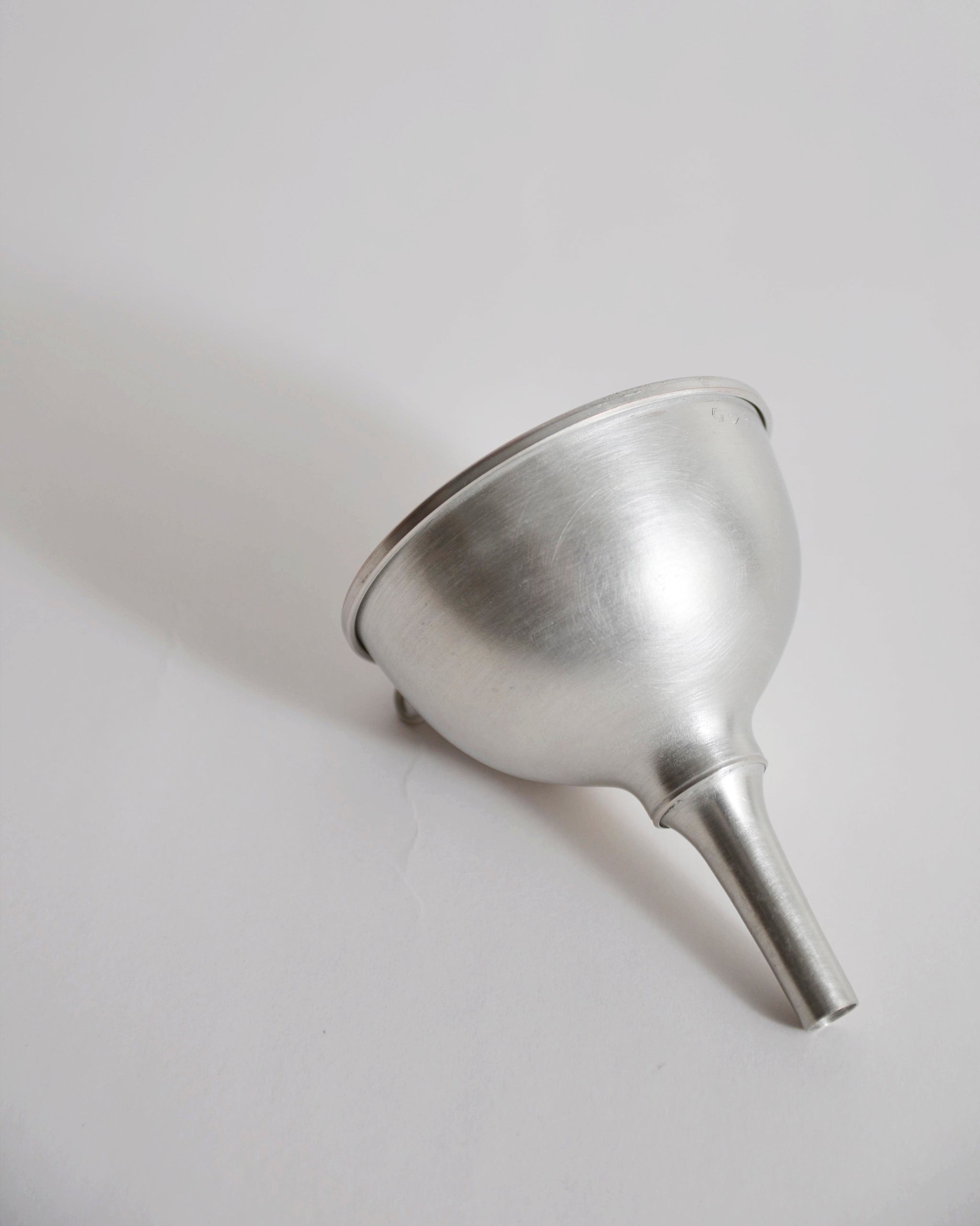 Copper funnel with tin plating by Azmaya on a gray background