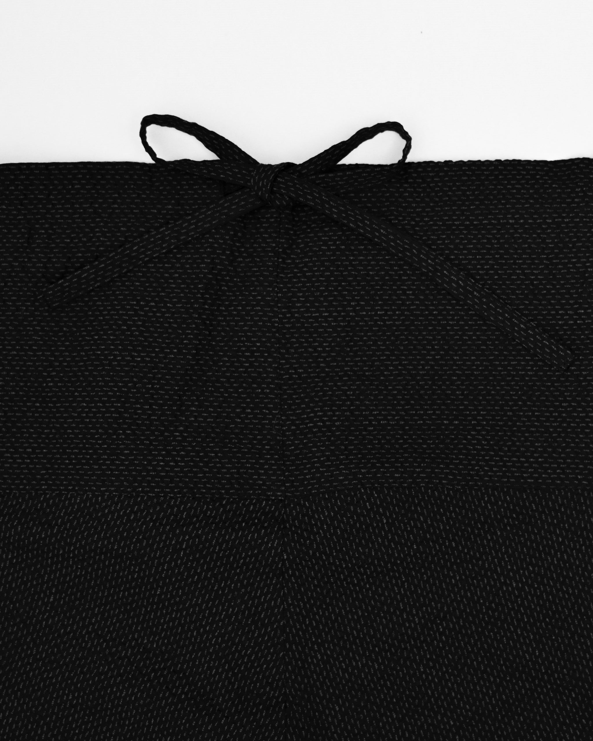 Up-close of Samue Loungewear Bottoms waist tie by Iwata on a light gray background