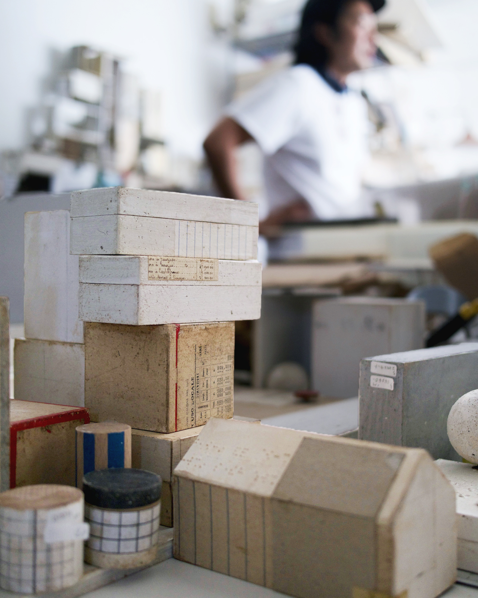Michiko Iwata's works in progress in the foreground with Stevenson Aung blurred in background