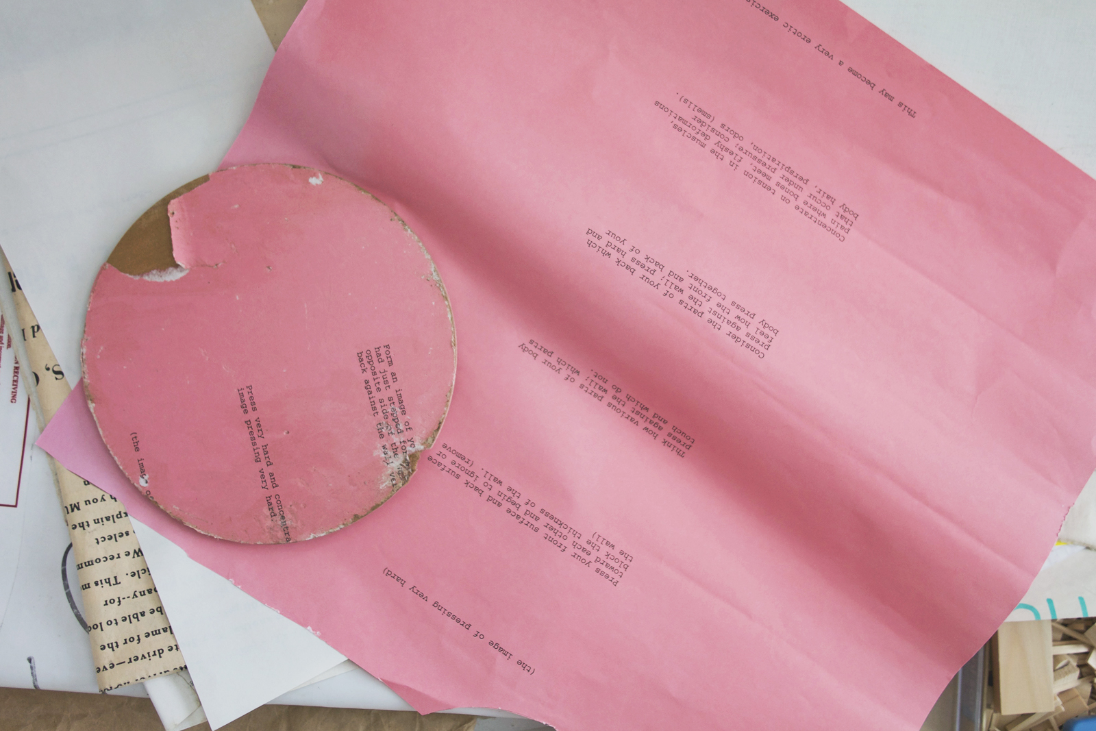 Pink cut up Bruce Nauman poster with text