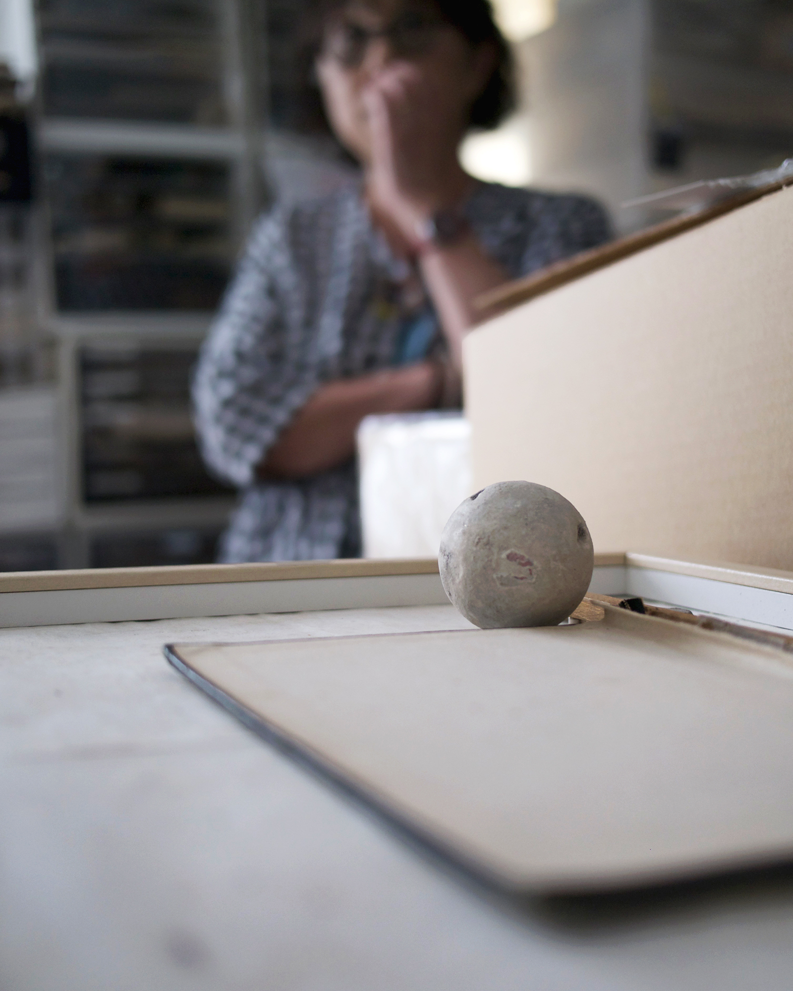 Hand formed matte texture sphere with Michiko Iwata blurred in the foreground