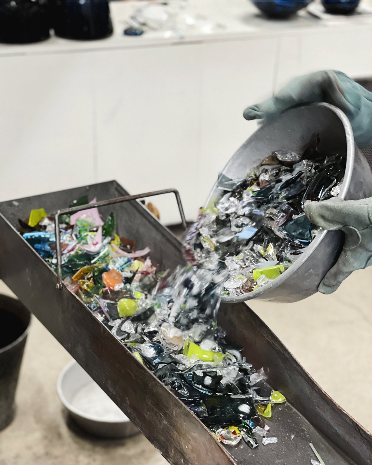 Pouring glass shards to sort