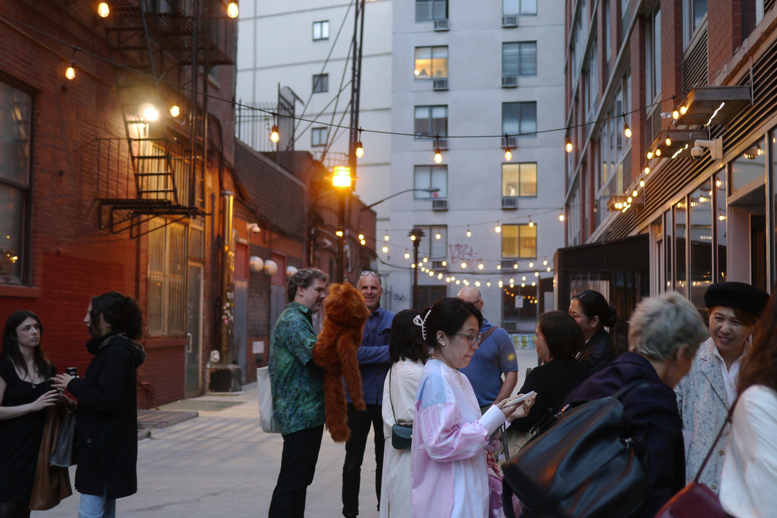 Guests at Relife Reclaimed Blue Factory Zoomer exhibition at Nalata Nalata Gallery in the Extra Place Alley