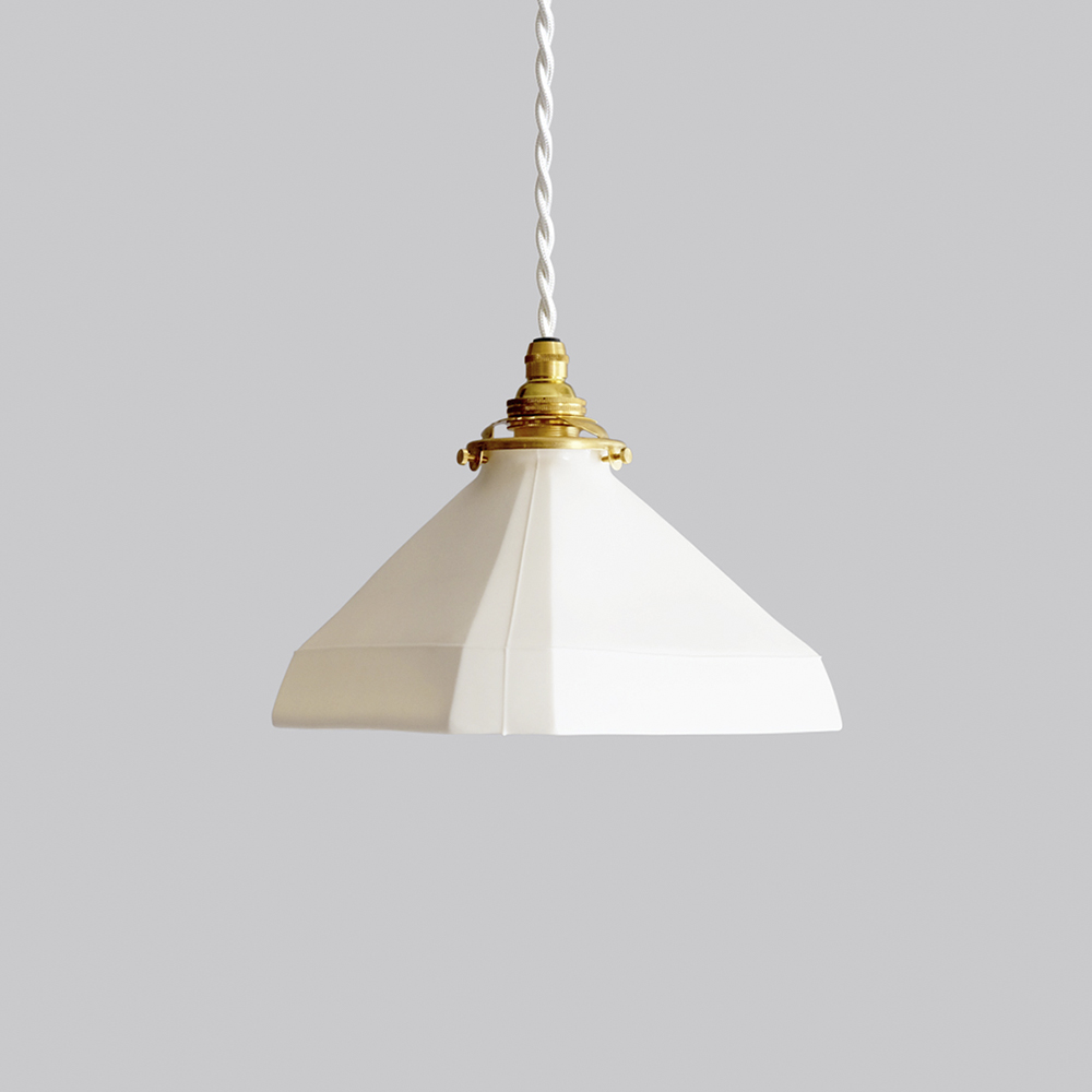 Hanging facet triangle, smooth pendant lamp by Tobimatsu Toki on a gray background