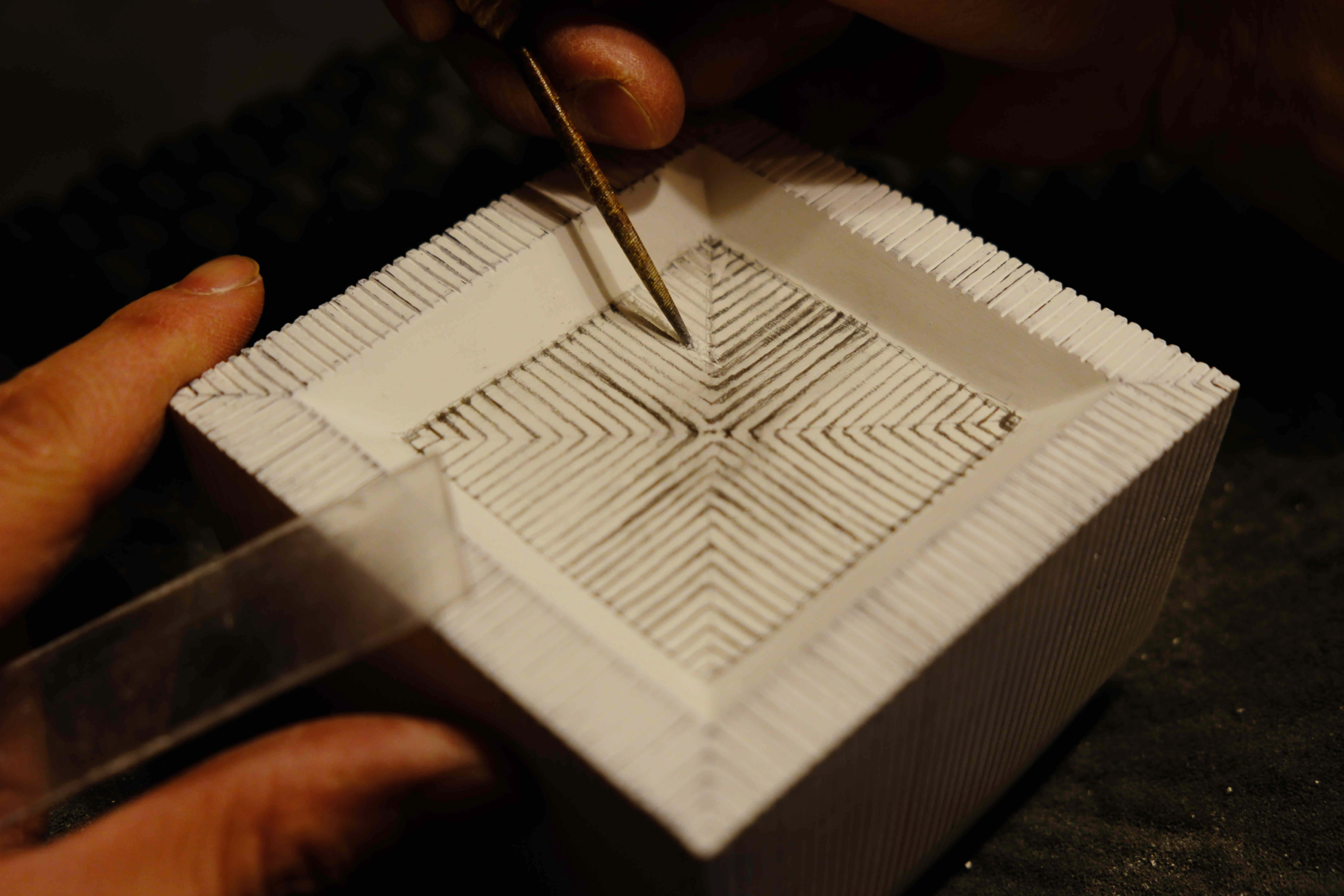 Close up of Hirotaka Tobimatsu precision carving a mold for the Square Fine Line pendant Nalata Nalata exclusive collaboration