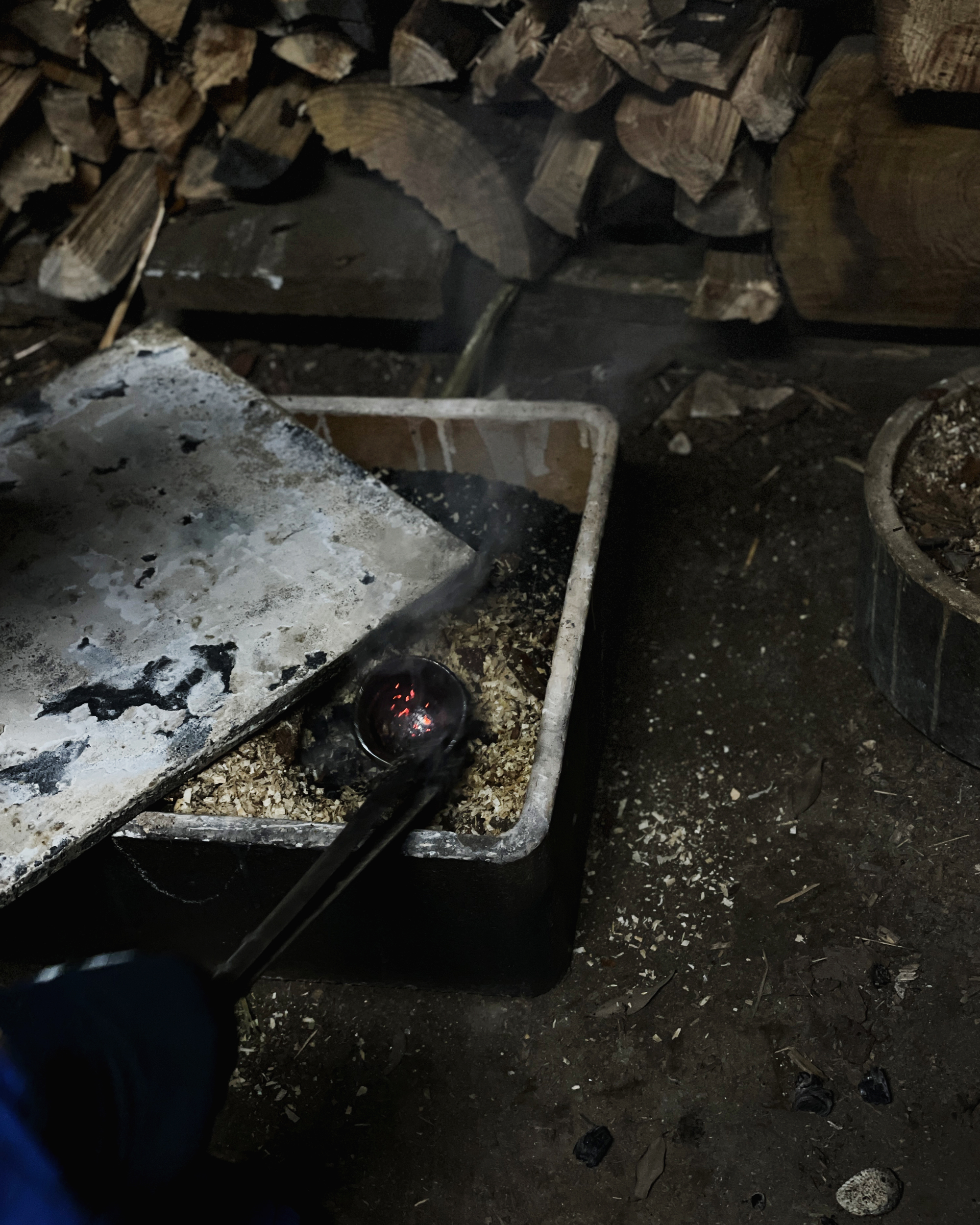 Container of ash and sand used to throw in a just pulled out piece of hot anagama ceramics
