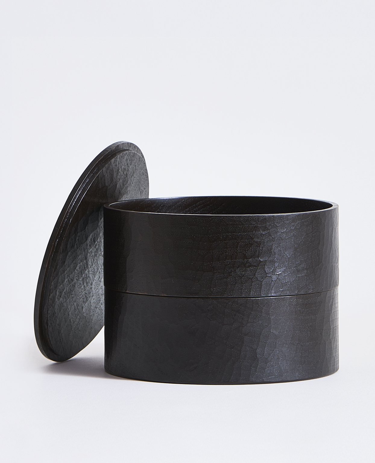Black two-tiered box by Ryuji Mitani on a gray background