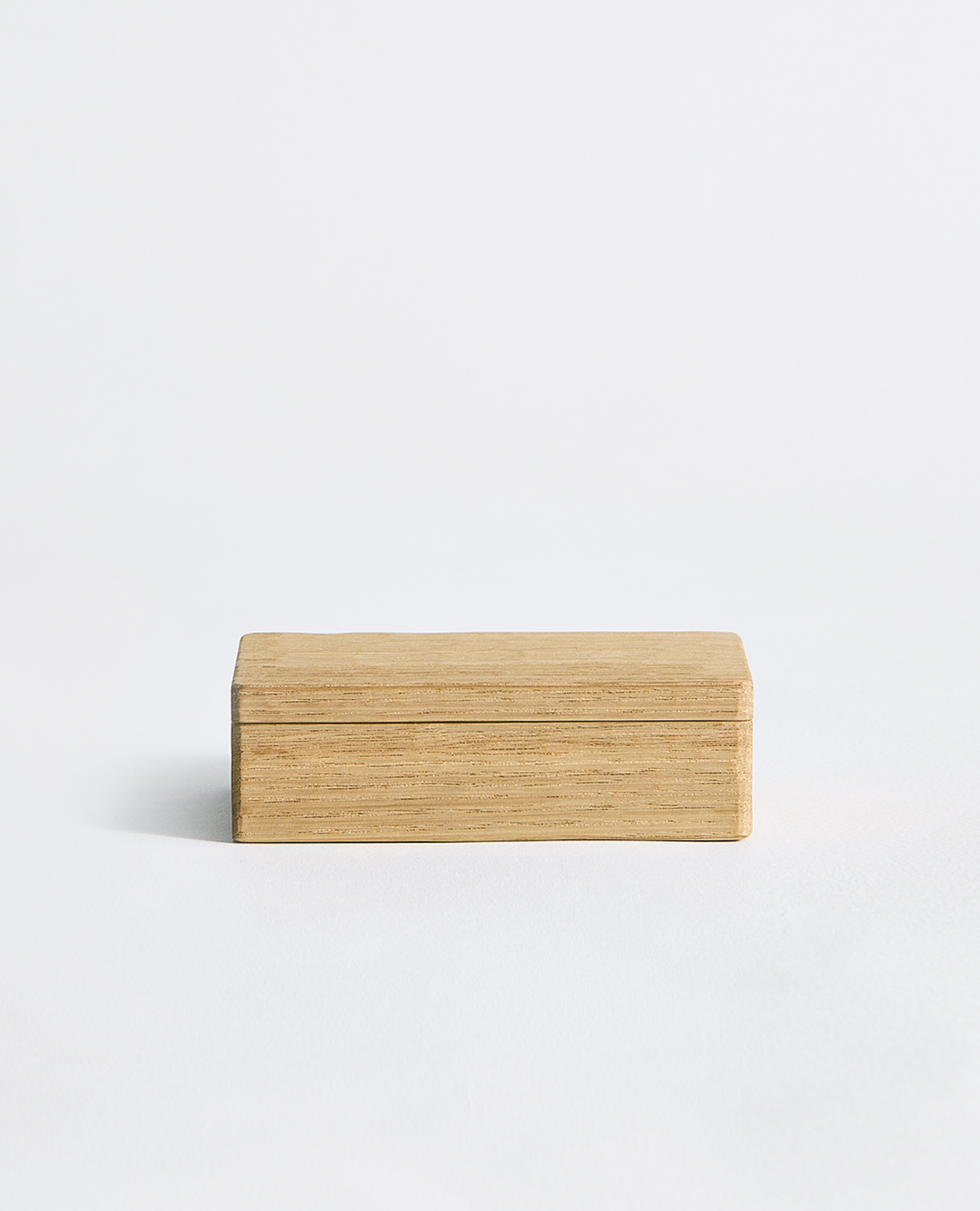 Light brown card box by Ryuji Mitani on a gray background