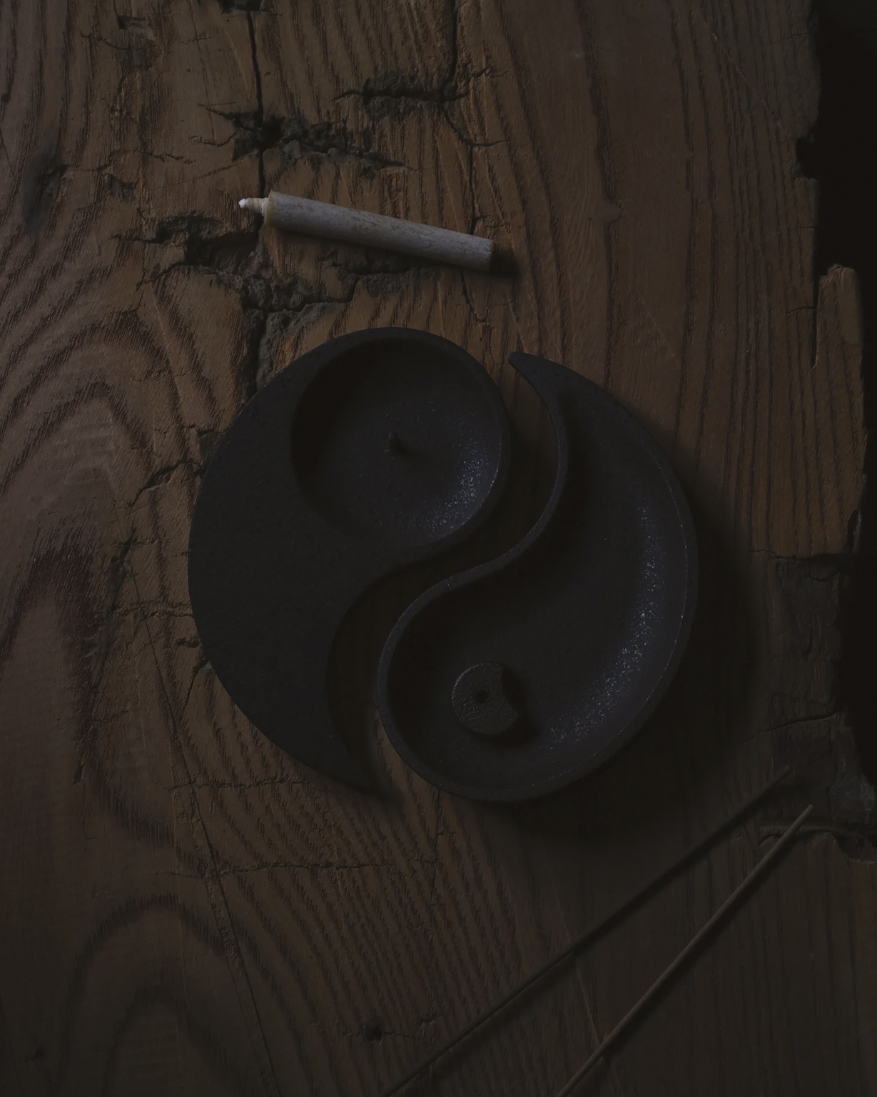 Incense holder, candle holder, and candle by Iwata from Nezen Boxed Set on a wooden background